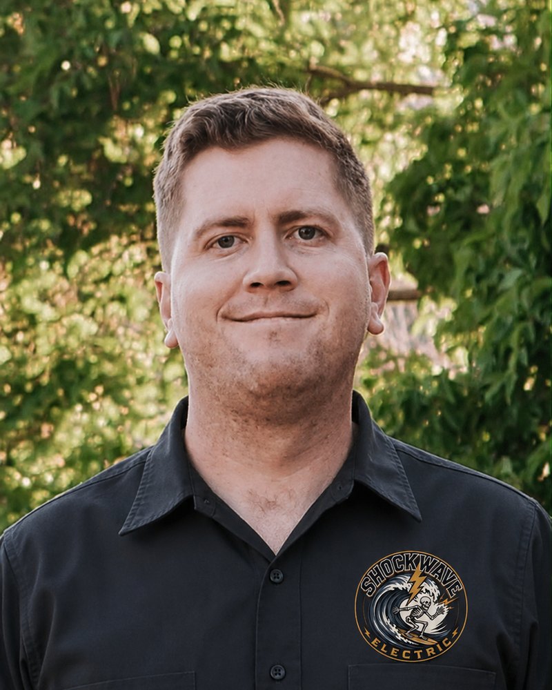 Jayson Kilpatrick, owner of Shockwave Electric, in a branded work shirt.